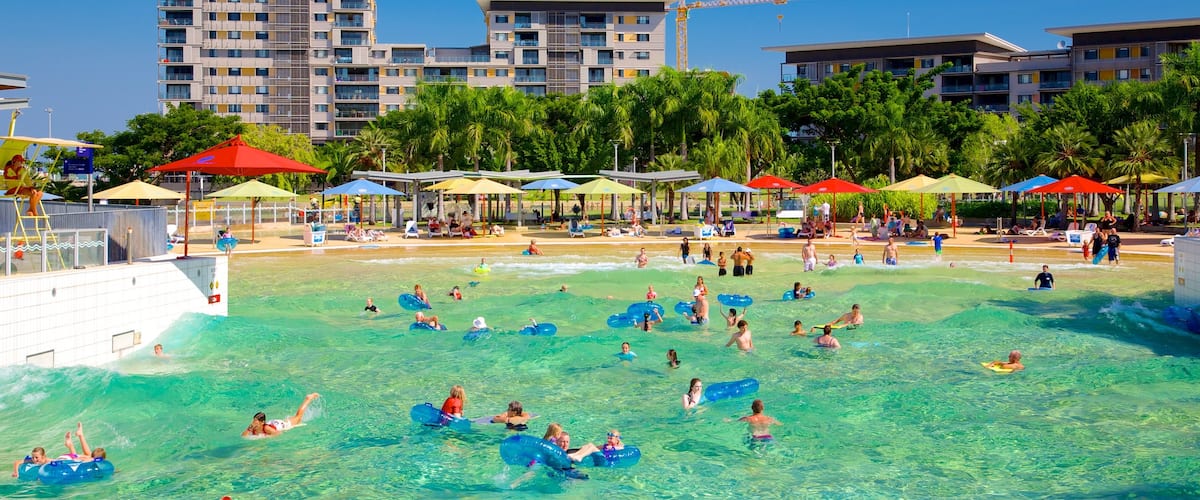 Darwin Waterfront which includes a pool and swimming as well as a large group of people