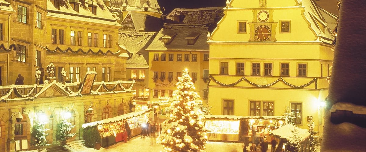 Rothenburg ob der Tauber featuring snow, night scenes and a square or plaza