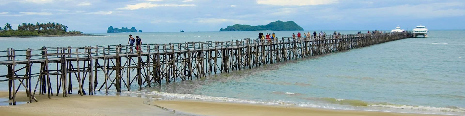 Chumphon which includes a beach and a bridge