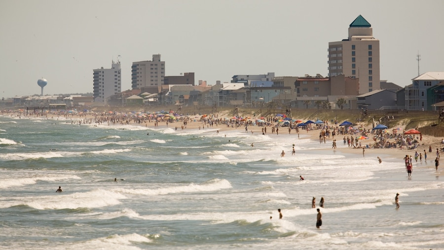 Carolina Beach featuring a coastal town, waves and a beach