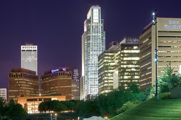 Downtown Omaha which includes a high-rise building, night scenes and modern architecture