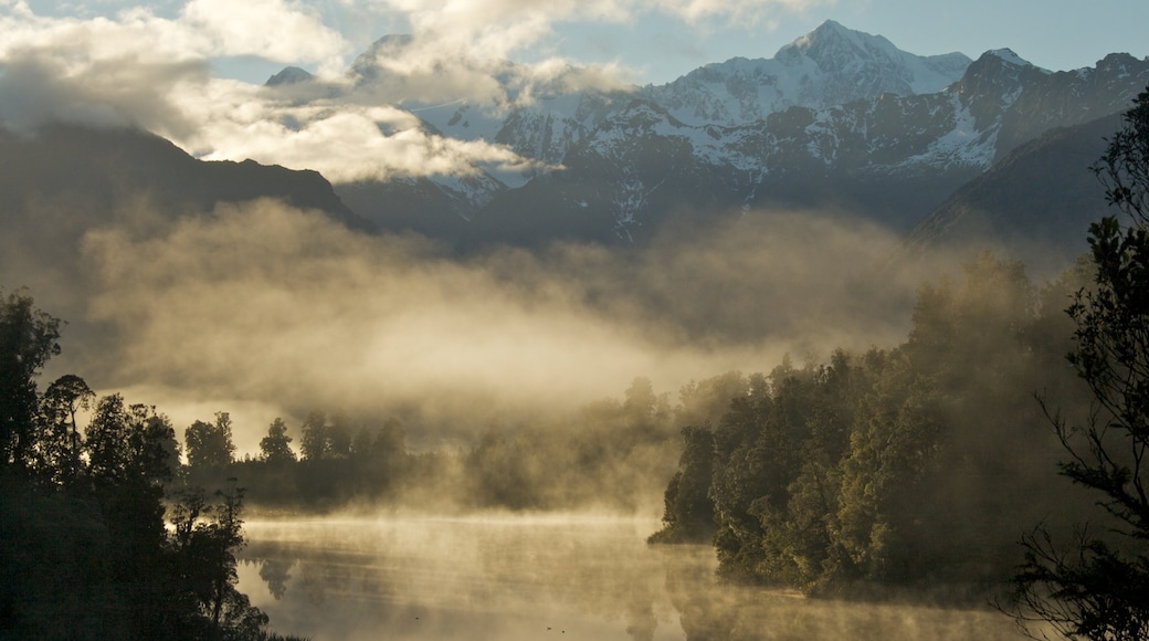 South Island which includes a lake or waterhole and mist or fog