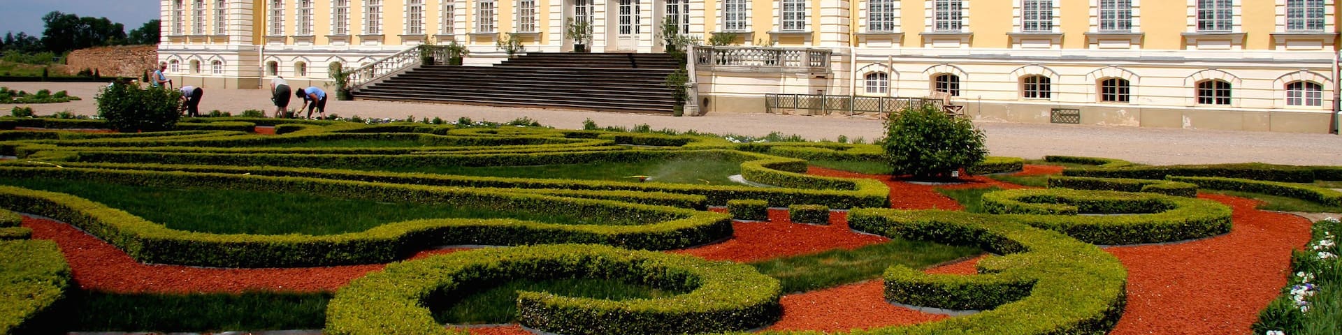 Latvia featuring a garden and heritage architecture