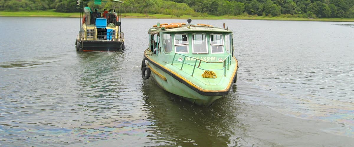 Thekkady showing a lake or waterhole and boating