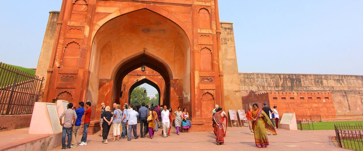 Agra Fort which includes heritage architecture as well as a large group of people