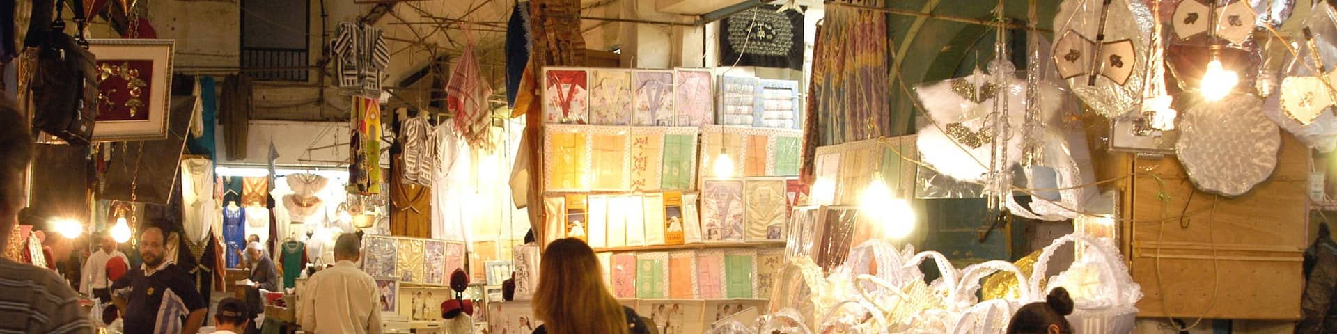 Tunis featuring markets as well as a small group of people