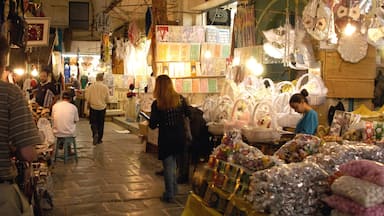 Tunis showing markets as well as a small group of people