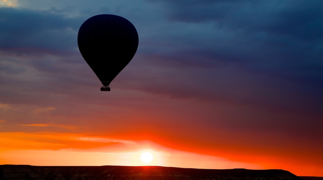 Cappadocia featuring ballooning and a sunset