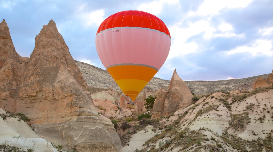 Rose Valley which includes a gorge or canyon, mountains and ballooning