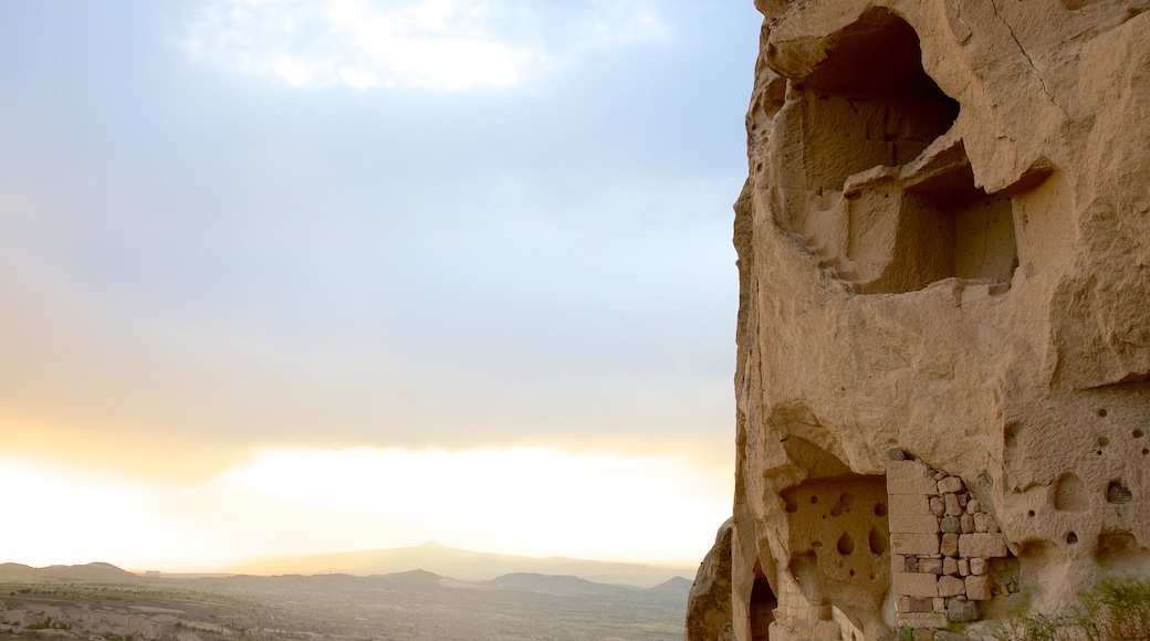 Uchisar Castle featuring a sunset