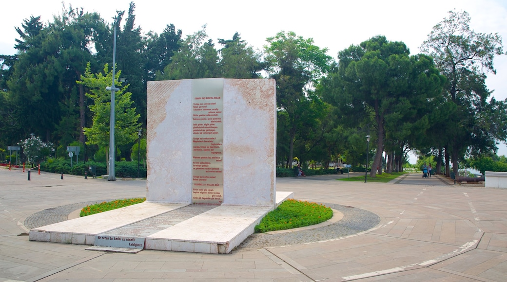 Karaalioglu Park featuring a garden, outdoor art and signage