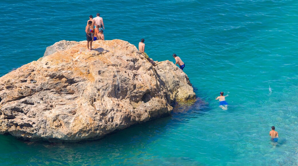 Konyaalti Beach Park which includes rocky coastline, swimming and landscape views