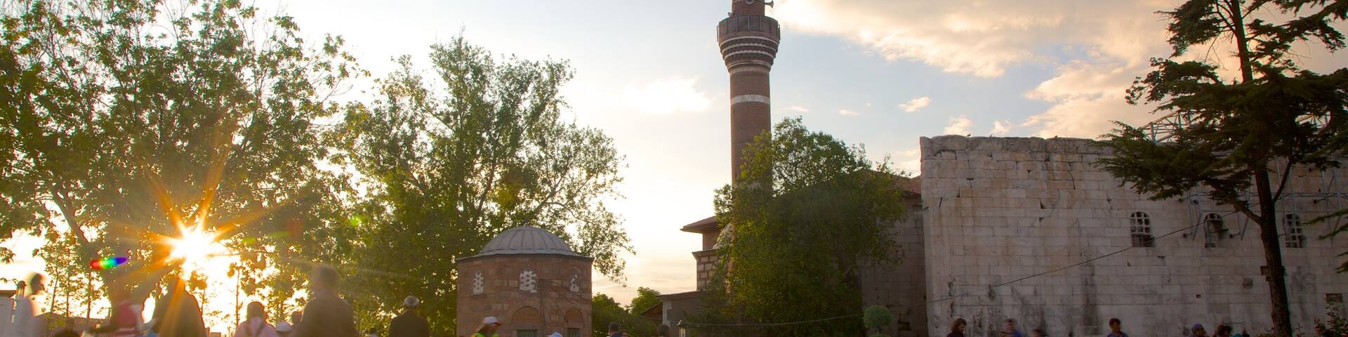 Haci Bayram Mosque which includes a mosque and a sunset