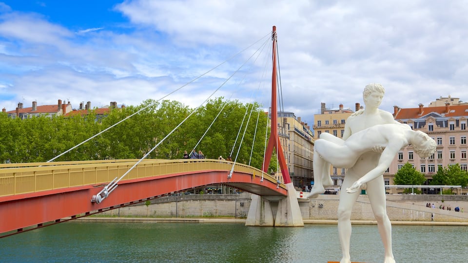 Bellecour Square showing a bridge, a river or creek and a statue or sculpture