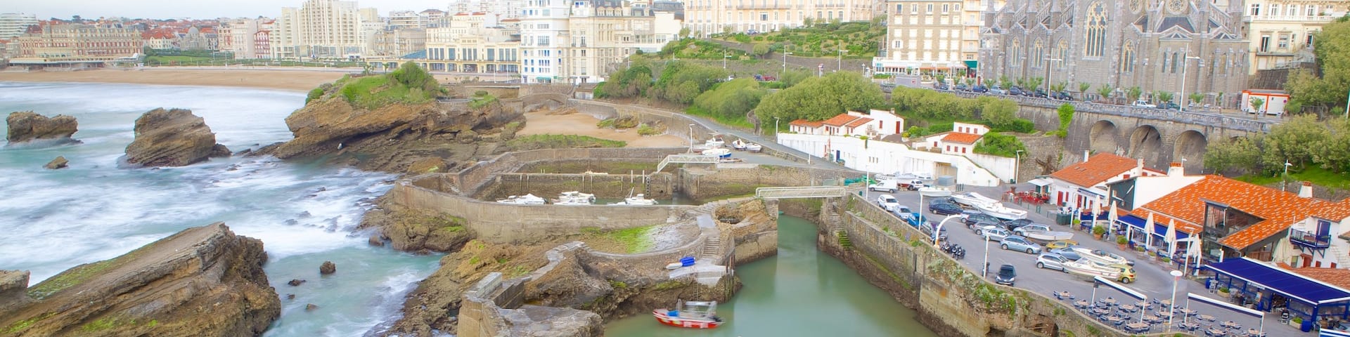 Old Harbor showing rugged coastline and a coastal town