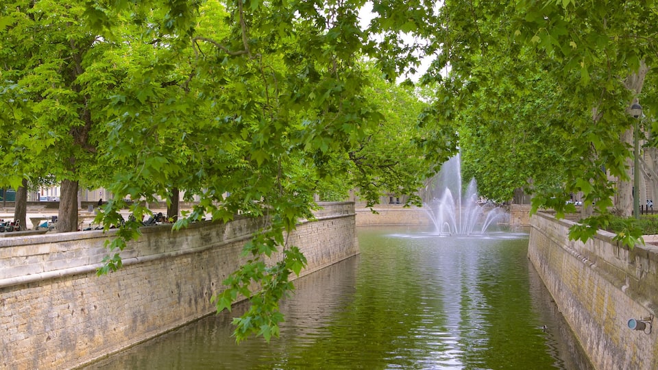 Nimes which includes a river or creek and a fountain