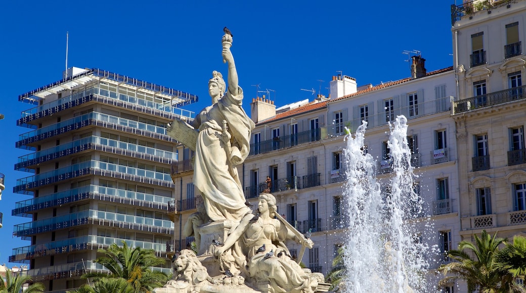 Place de la Liberte which includes a fountain and a statue or sculpture