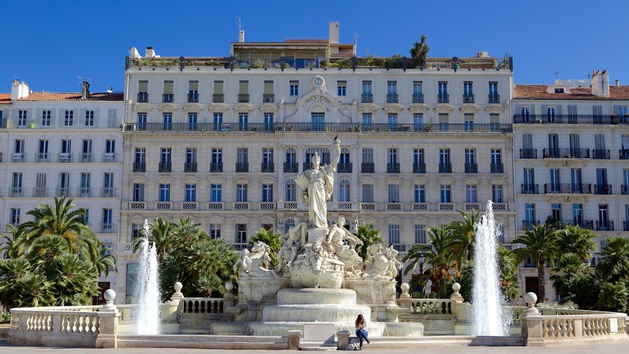 Place de la Liberte which includes a fountain, a square or plaza and a statue or sculpture