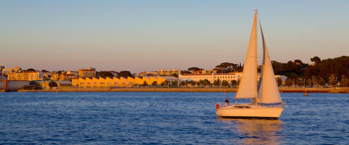 Toulon featuring general coastal views, a coastal town and a sunset