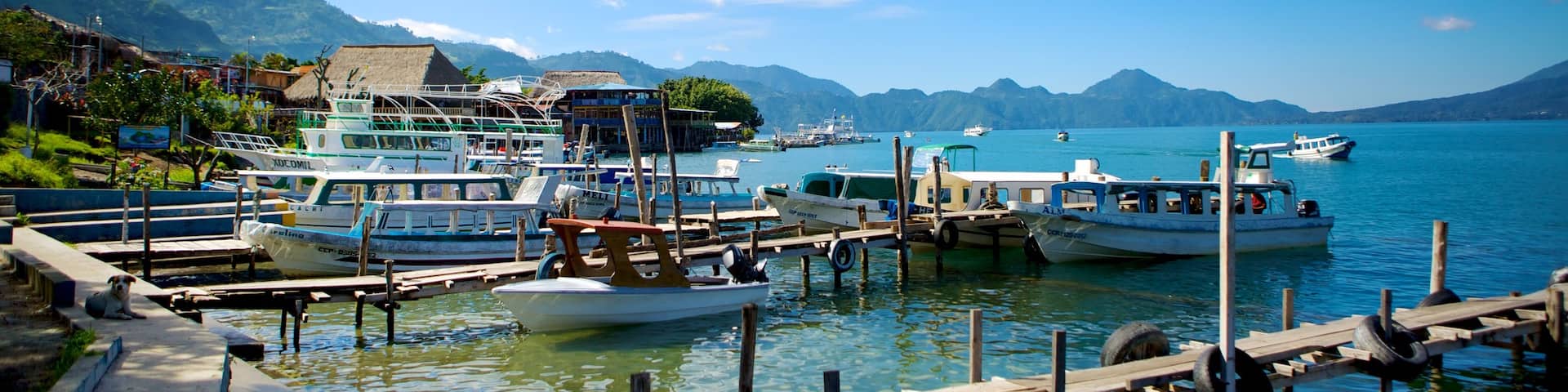 Panajachel which includes a bay or harbor, a lake or waterhole and boating