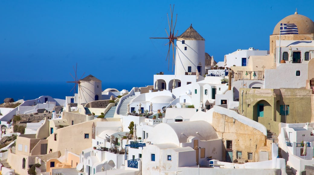 Oia which includes a windmill and a coastal town