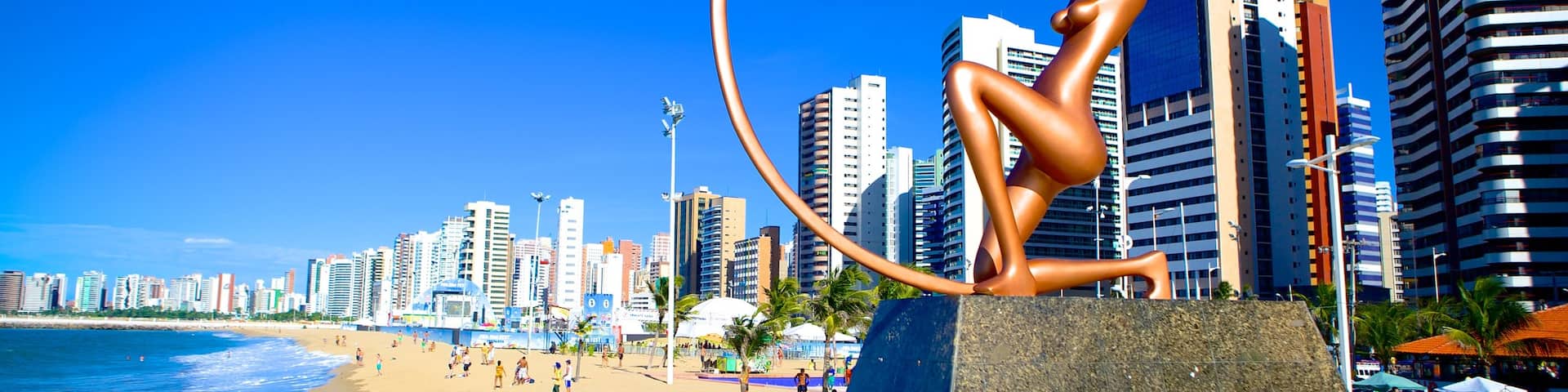 Fortaleza showing a beach, outdoor art and central business district