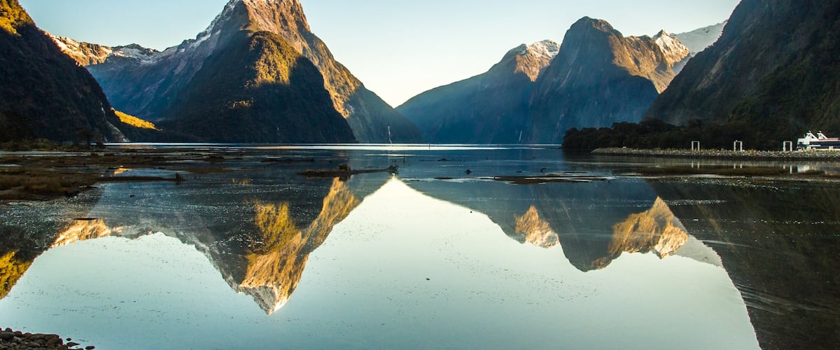 Milford Sound showing a river or creek and mountains