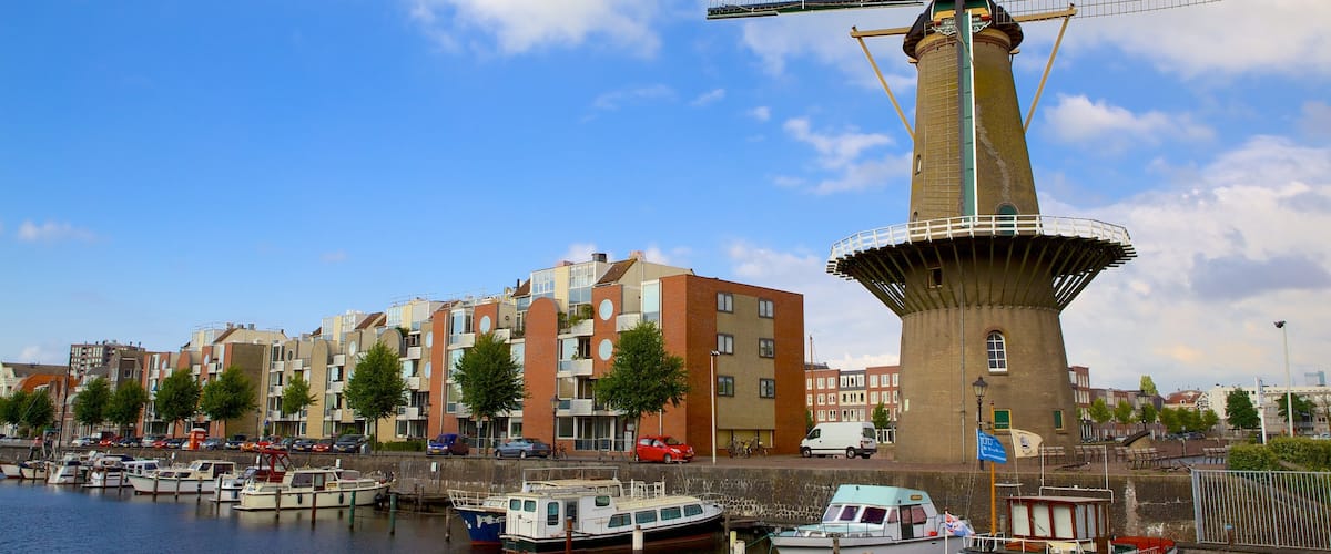 Delfshaven showing a windmill, a bay or harbor and a river or creek