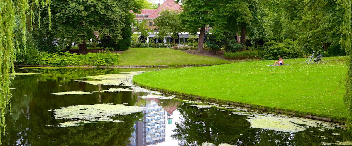 Euromast featuring a garden, landscape views and a lake or waterhole