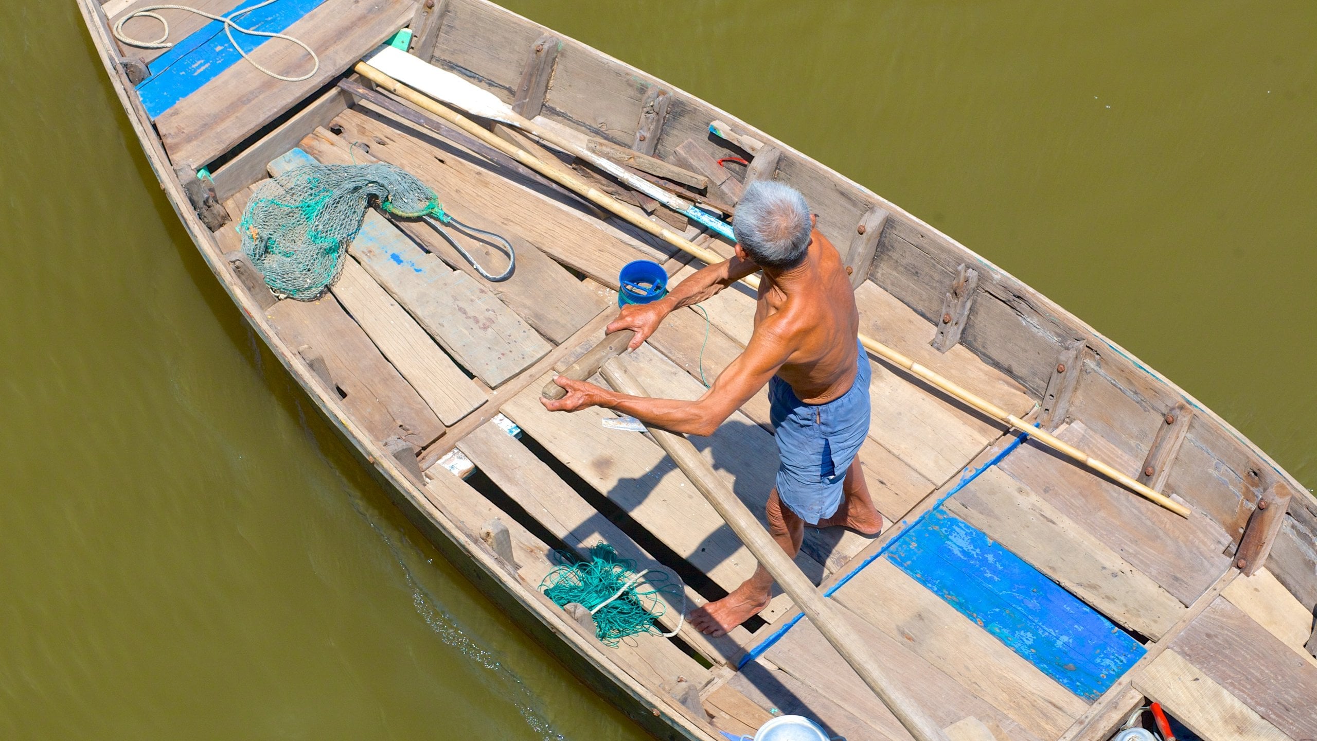 Phan Thiet showing boating and general coastal views as well as an individual male