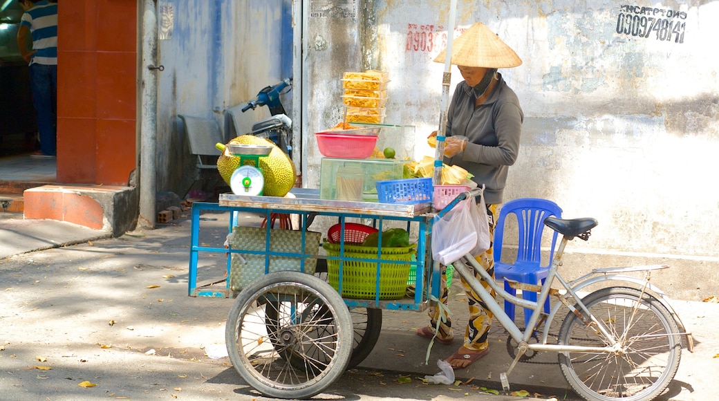 Bui Thi Xuan featuring markets and street scenes as well as an individual female