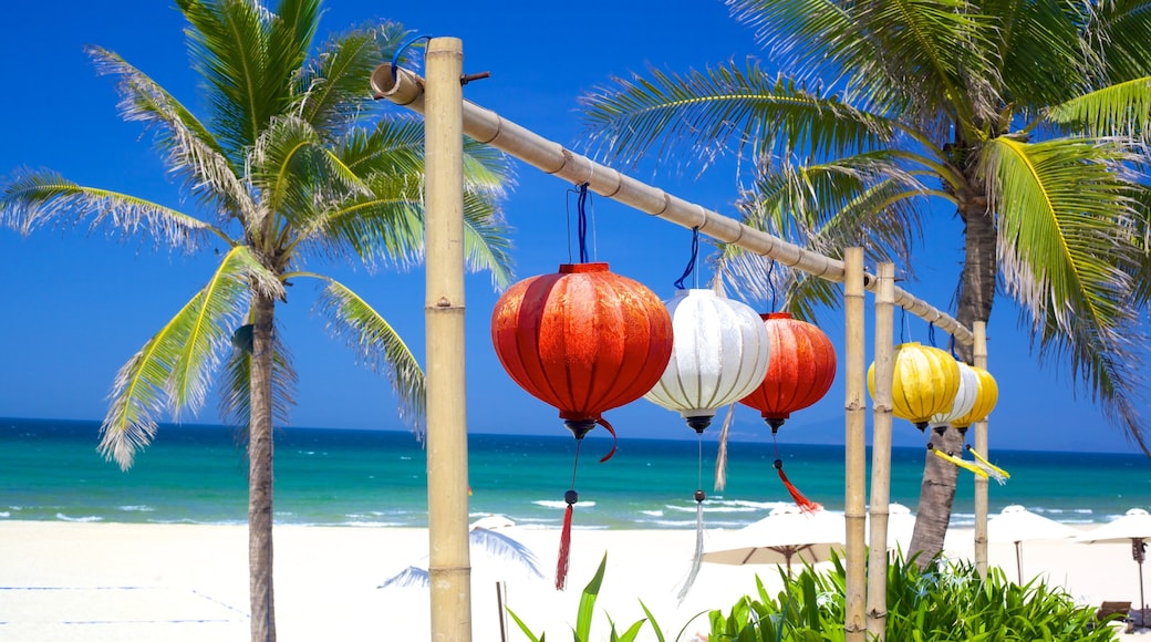 Non Nuoc Beach showing a sandy beach and tropical scenes