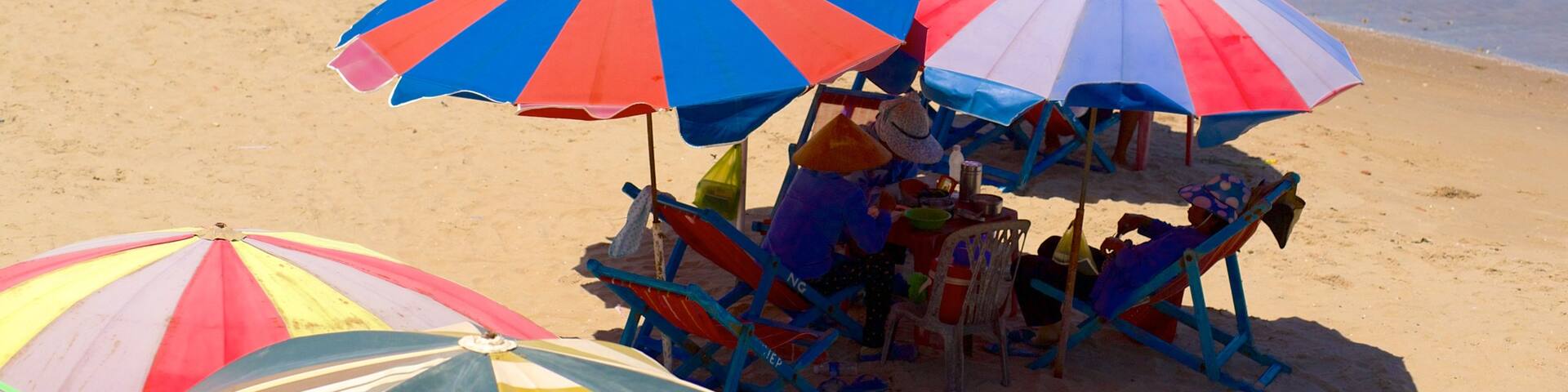 Back Beach showing a luxury hotel or resort and a sandy beach