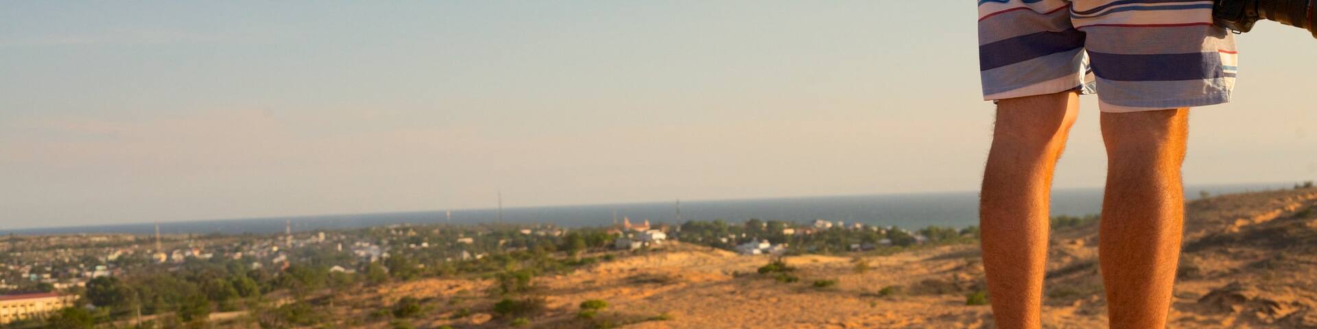 Mui Ne Sand Dunes which includes desert views as well as an individual male