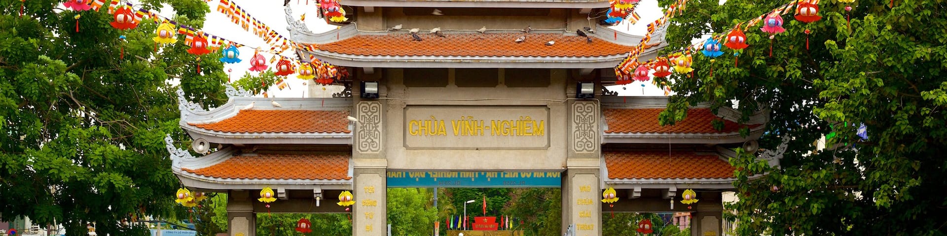 Vinh Nghiem Pagoda featuring street scenes and a temple or place of worship