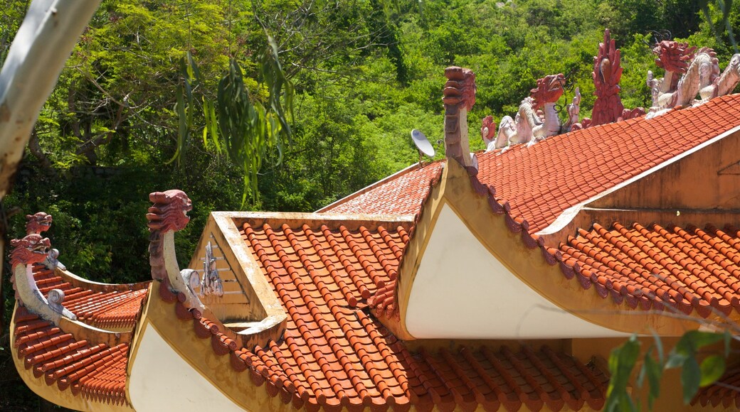 Minh Dam Mountain showing a temple or place of worship and heritage architecture