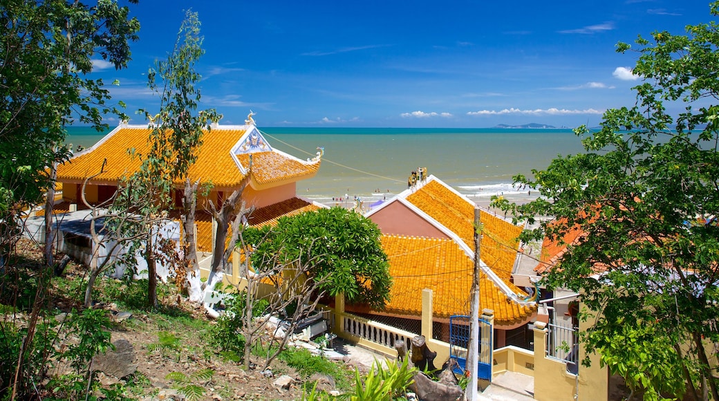 Dinh Co Temple which includes a coastal town, a temple or place of worship and general coastal views