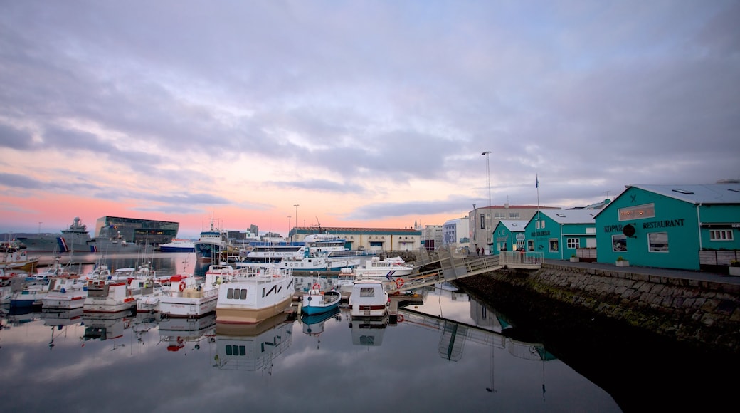 Reykjavik Harbour showing a sunset, a bay or harbour and boating