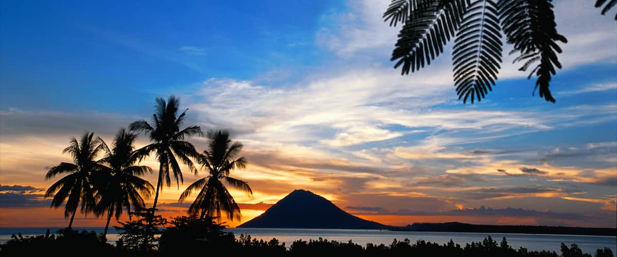 Manado showing a sunset, tropical scenes and general coastal views
