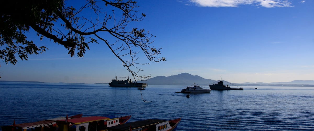 Manado which includes general coastal views and boating