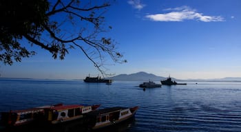 Manado which includes general coastal views and boating