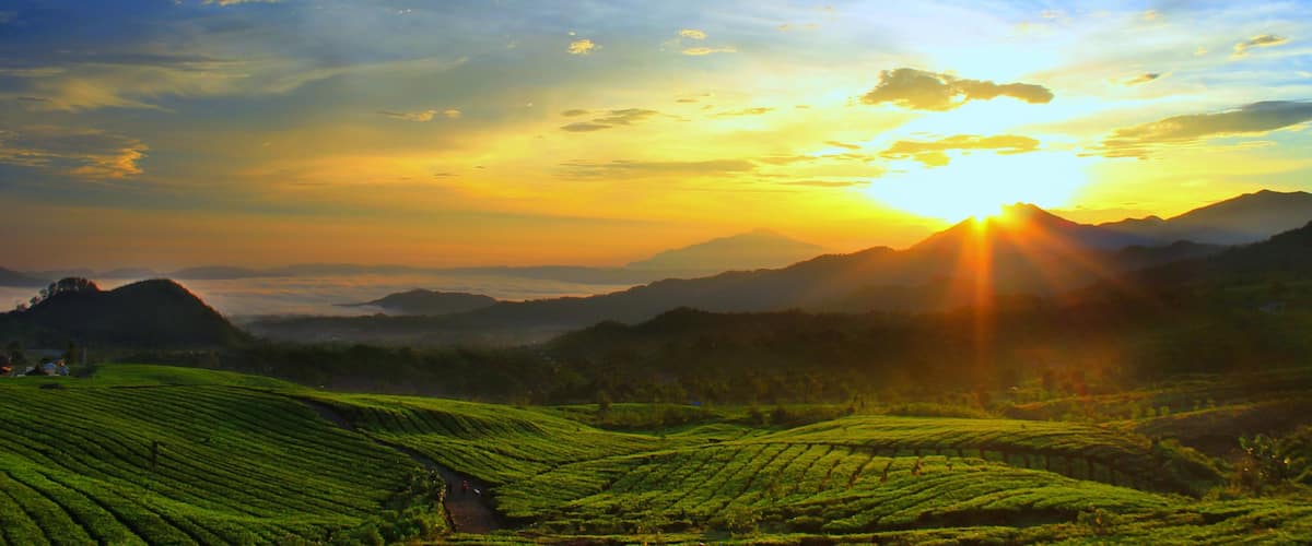 Bandung featuring a sunset, landscape views and mountains