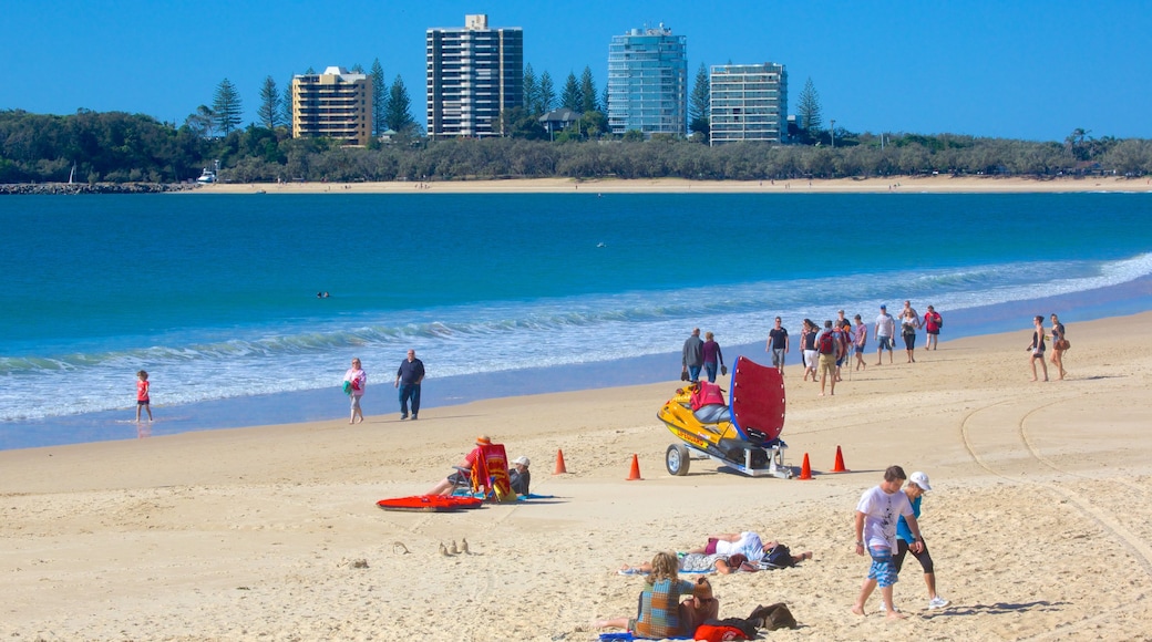 Mooloolaba Beach featuring a sandy beach as well as a large group of people