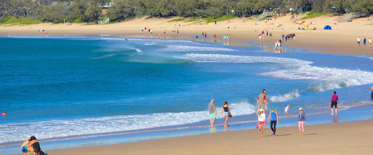 Mooloolaba Beach showing a bay or harbor and a beach as well as a large group of people