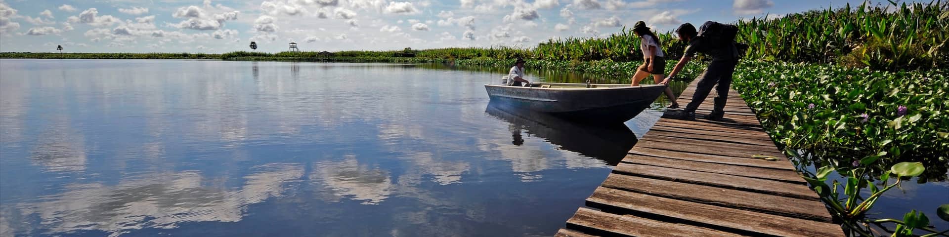 Formosa which includes boating and a river or creek as well as a small group of people