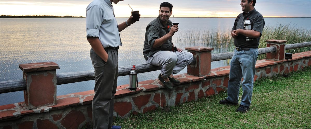 Corrientes showing a river or creek as well as a small group of people