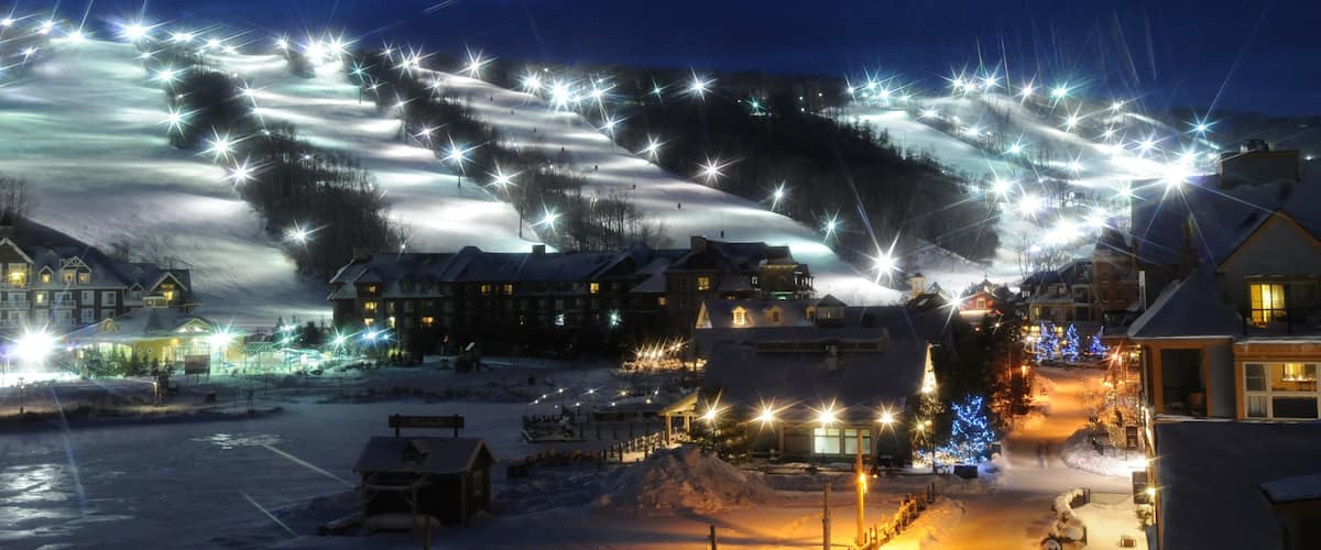 Blue Mountain Ski Resort showing night scenes, a small town or village and a luxury hotel or resort