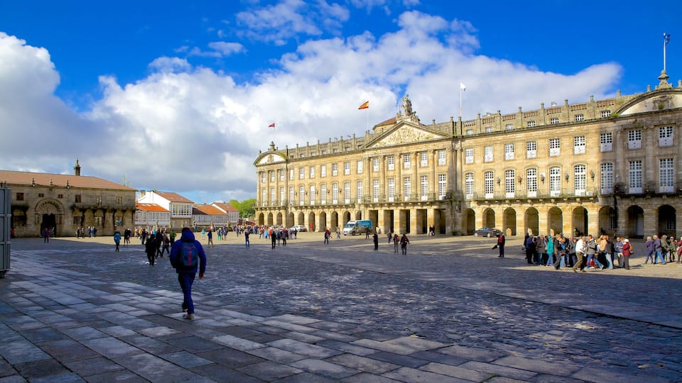 Obradoiro Square featuring heritage architecture and a square or plaza as well as a large group of people