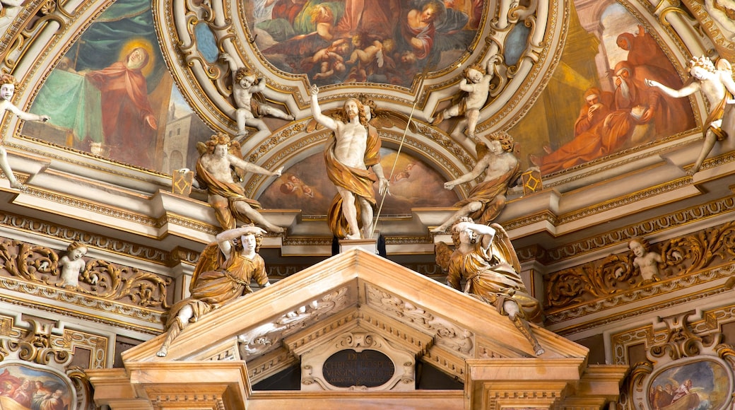 San Vittore Basilica featuring art, a statue or sculpture and interior views