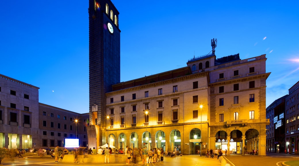 Varese showing a square or plaza, night scenes and street scenes